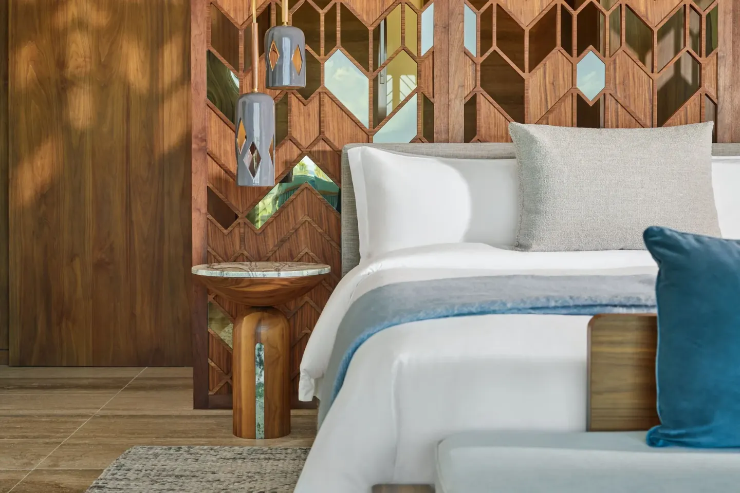 Ocean View Suite king bed detail at The St. Regis Kanai Resort, Riviera Maya with wood screen