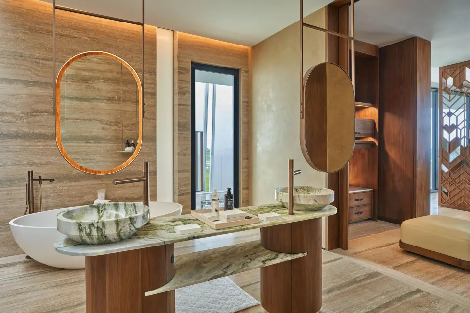Bathroom vanity and soaking tub in an Ocean View Suite at The St. Regis Kanai Resort, Riviera Maya.