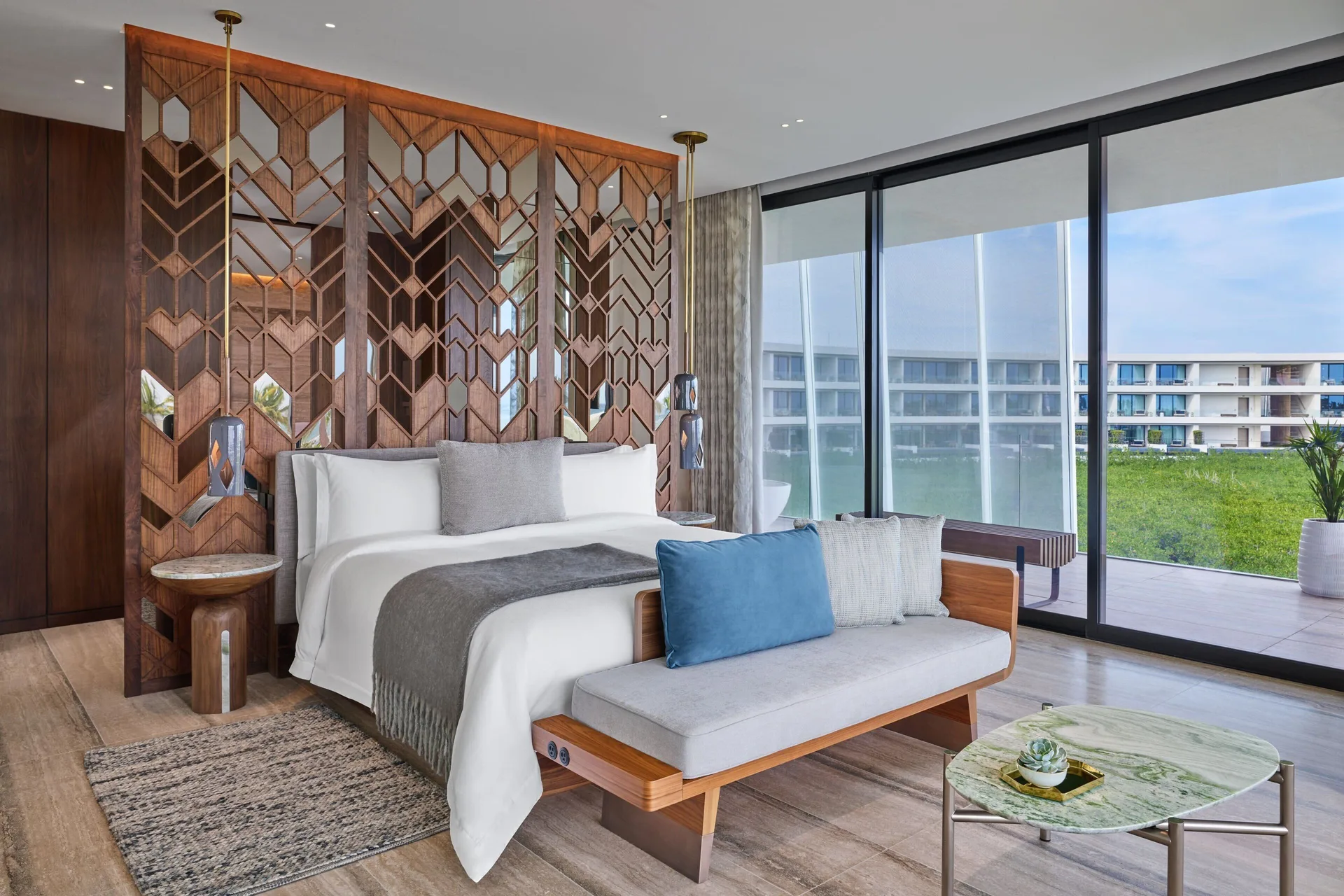 Suite One Bed Ocean View Corner at The St. Regis Kanai Resort with king bed and wraparound ocean views.
