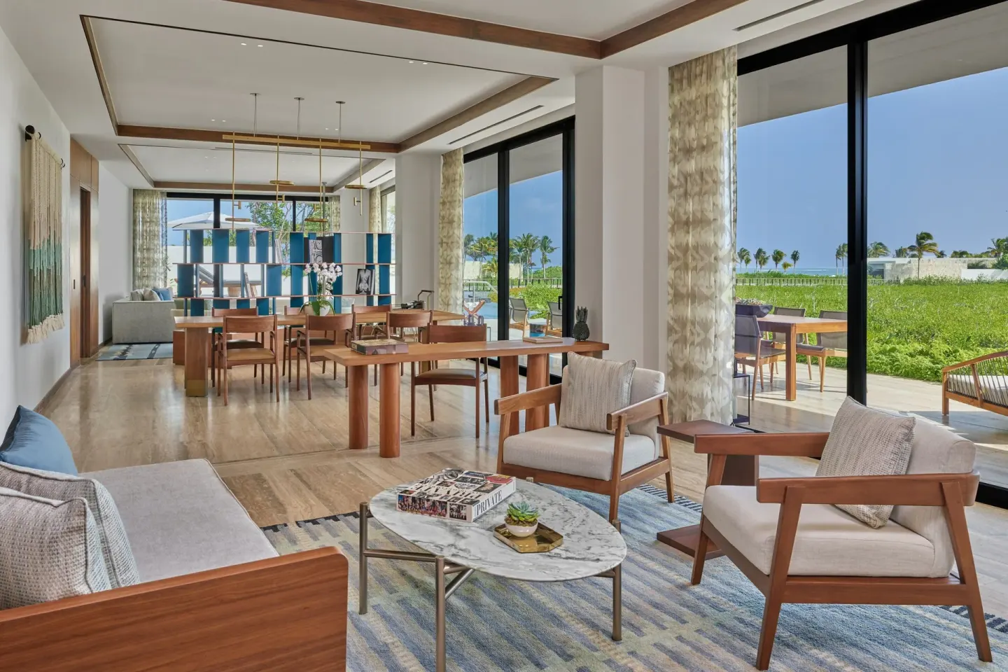 Living and dining area of an Ocean View Suite at The St. Regis Kanai Resort, Riviera Maya.
