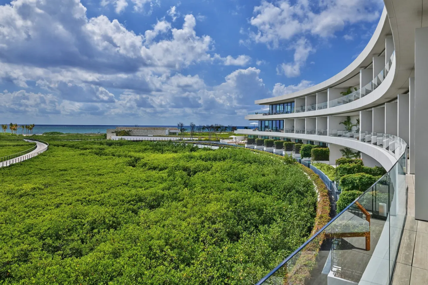 Ocean View Suite terrace view over greenery at The St. Regis Kanai Resort, Riviera Maya.