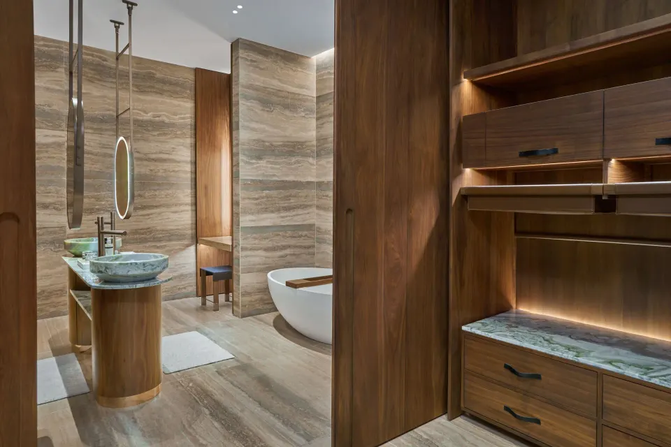 Ocean View Suite bathroom with vanity, tub, and closet at The St. Regis Kanai Resort, Riviera Maya.