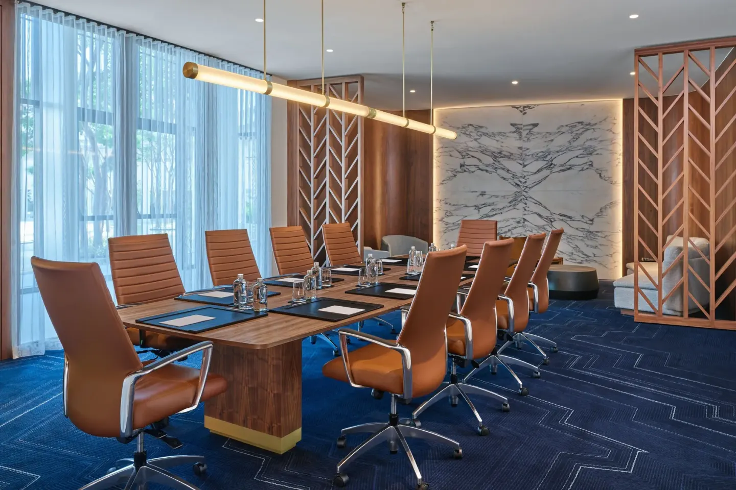 Boardroom with long table and leather chairs at The St. Regis Kanai Resort, Riviera Maya.