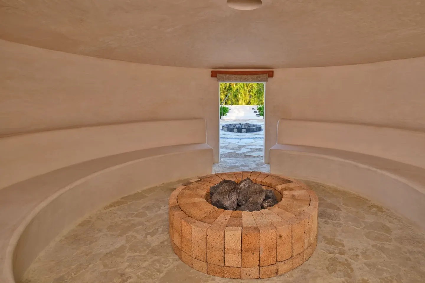 Circular steam room with a central stone feature at The St. Regis Punta Mita Resort.
