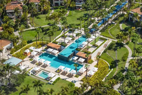 Aerial view of the main pool terrace and palm gardens at The St. Regis Punta Mita Resort.