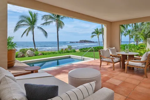 Covered terrace with plunge pool and ocean view at The St. Regis Punta Mita Resort.