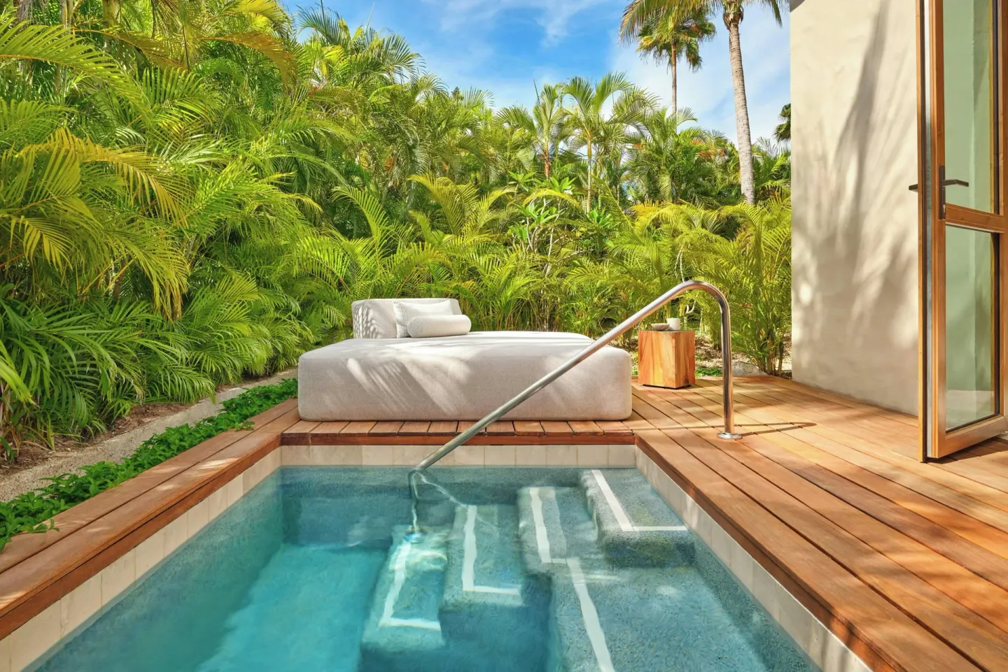 Private plunge pool and daybed on a tropical terrace at The St. Regis Punta Mita Resort.