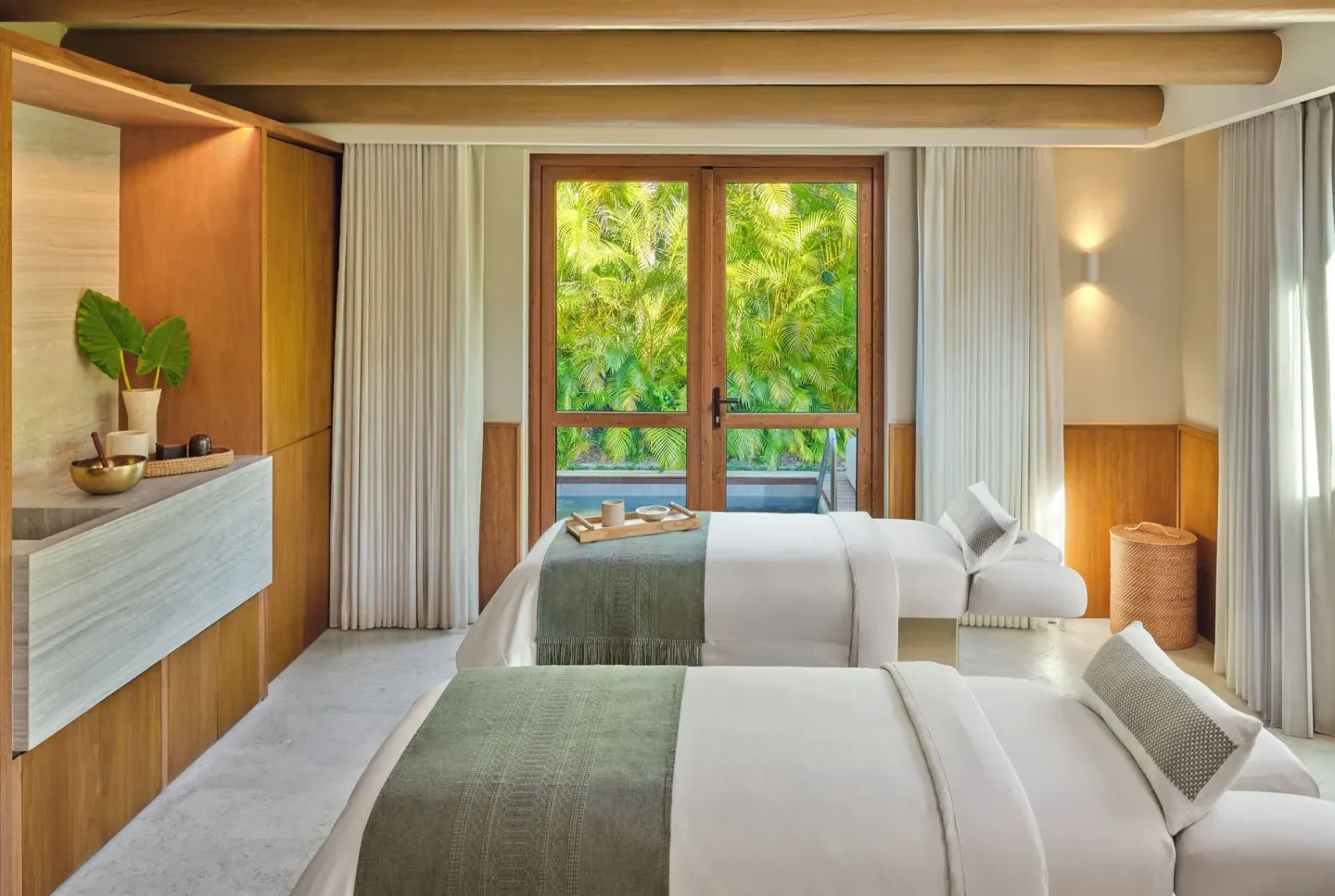 Twin massage beds in a spa treatment room at The St. Regis Punta Mita Resort.