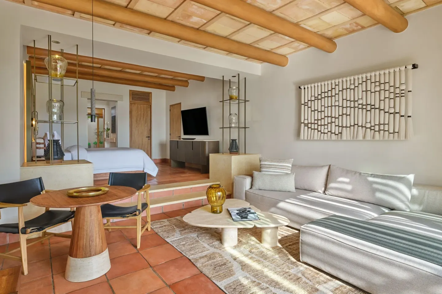 Junior Suite Garden View living area and king bed at The St. Regis Punta Mita Resort.