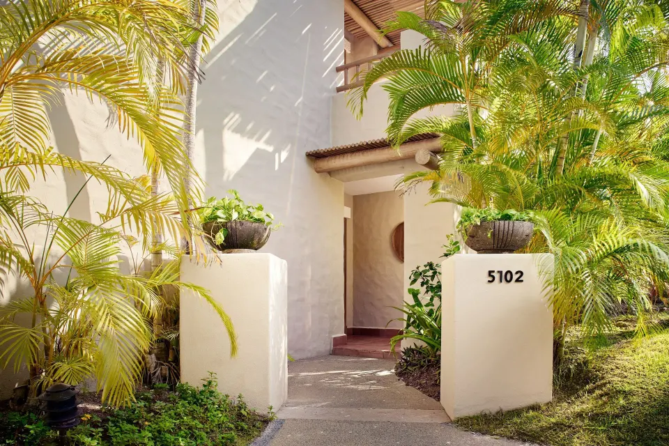 Garden path to a Junior Suite entrance at The St. Regis Punta Mita Resort.