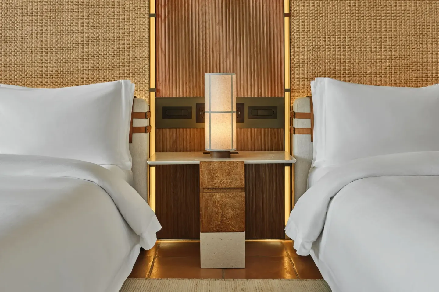 Two beds with a central nightstand in a Garden View room at The St. Regis Punta Mita Resort.