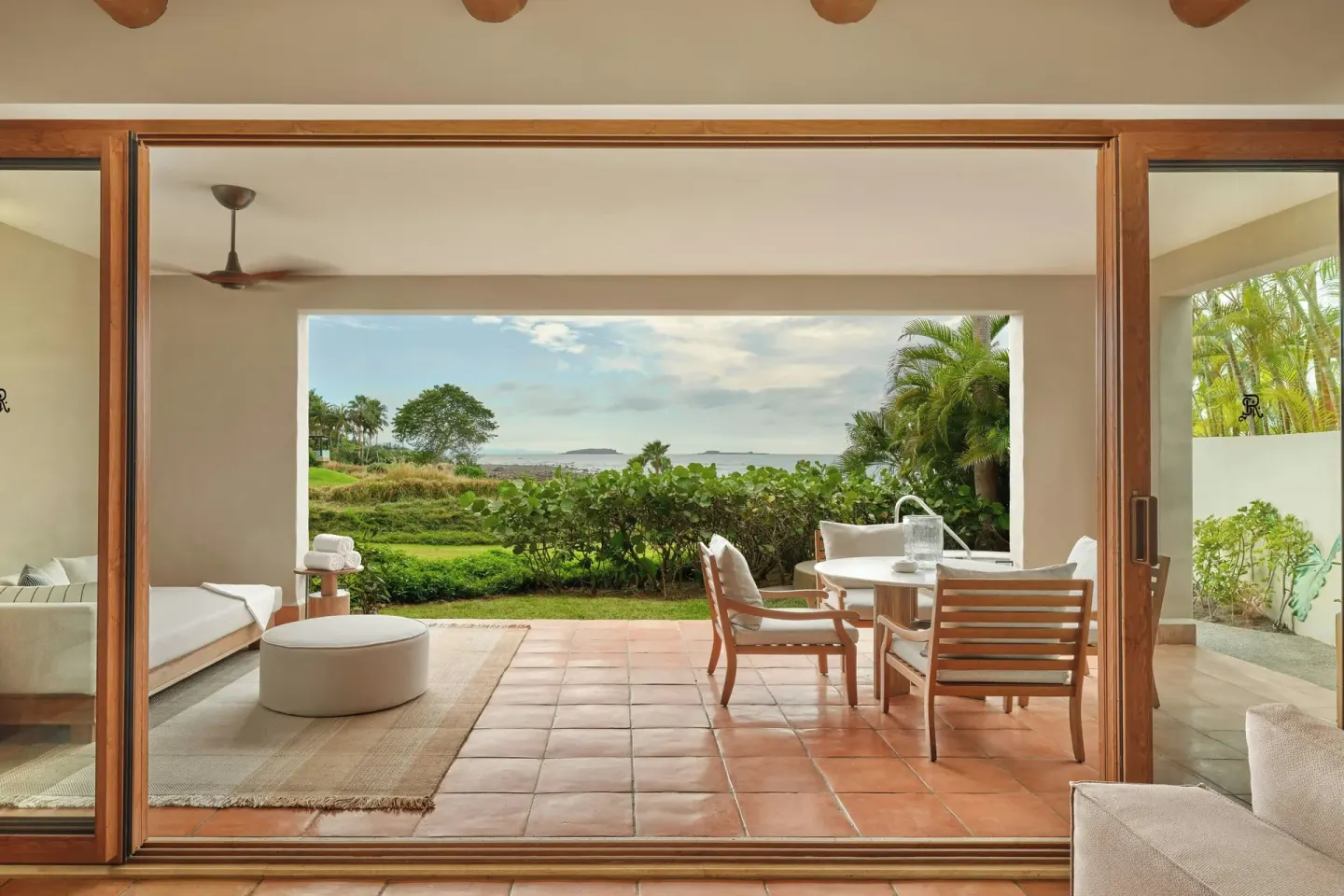 Covered terrace and garden view from a suite at The St. Regis Punta Mita Resort.