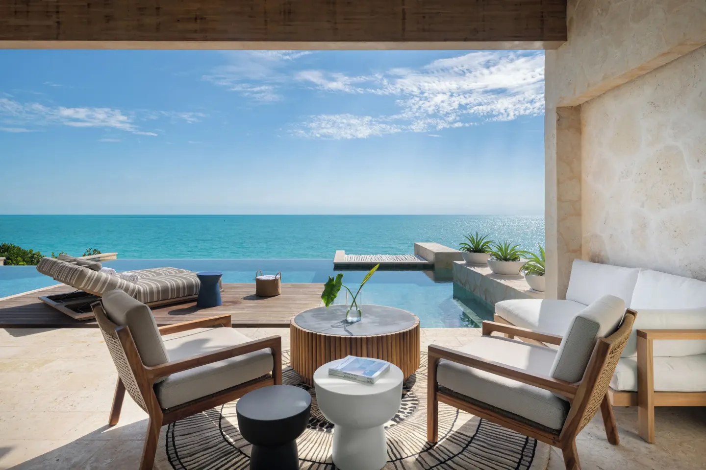 Covered oceanfront terrace with plunge pool at The Strand Turks and Caicos.
