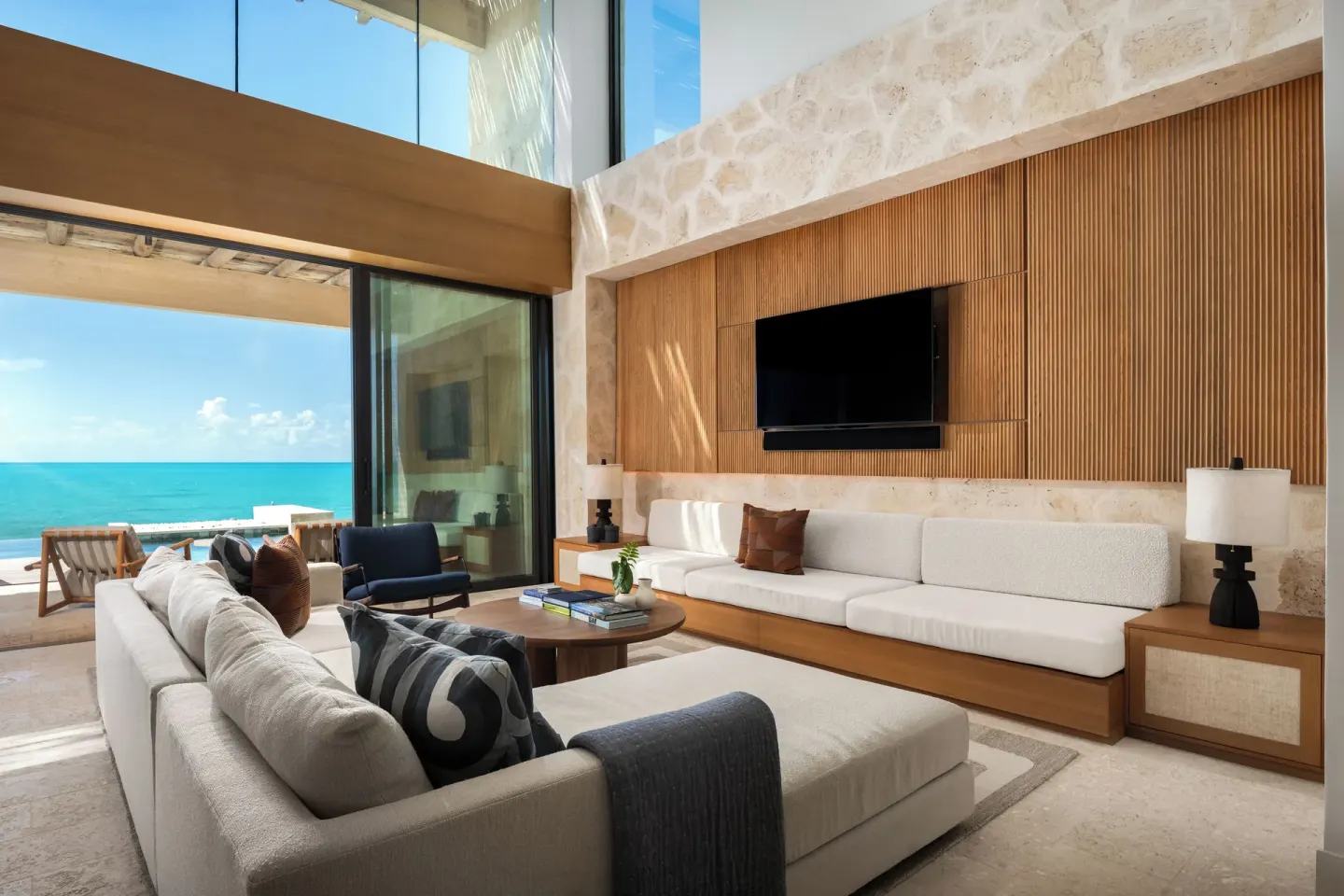 Living room with sofas and ocean view at The Strand Turks and Caicos.