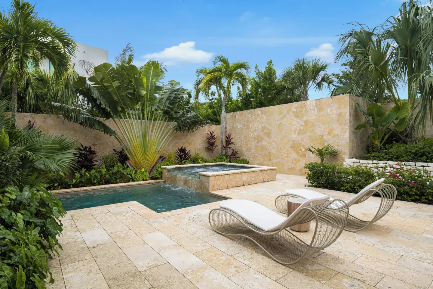 Private garden pool terrace with two loungers at The Strand Turks and Caicos.