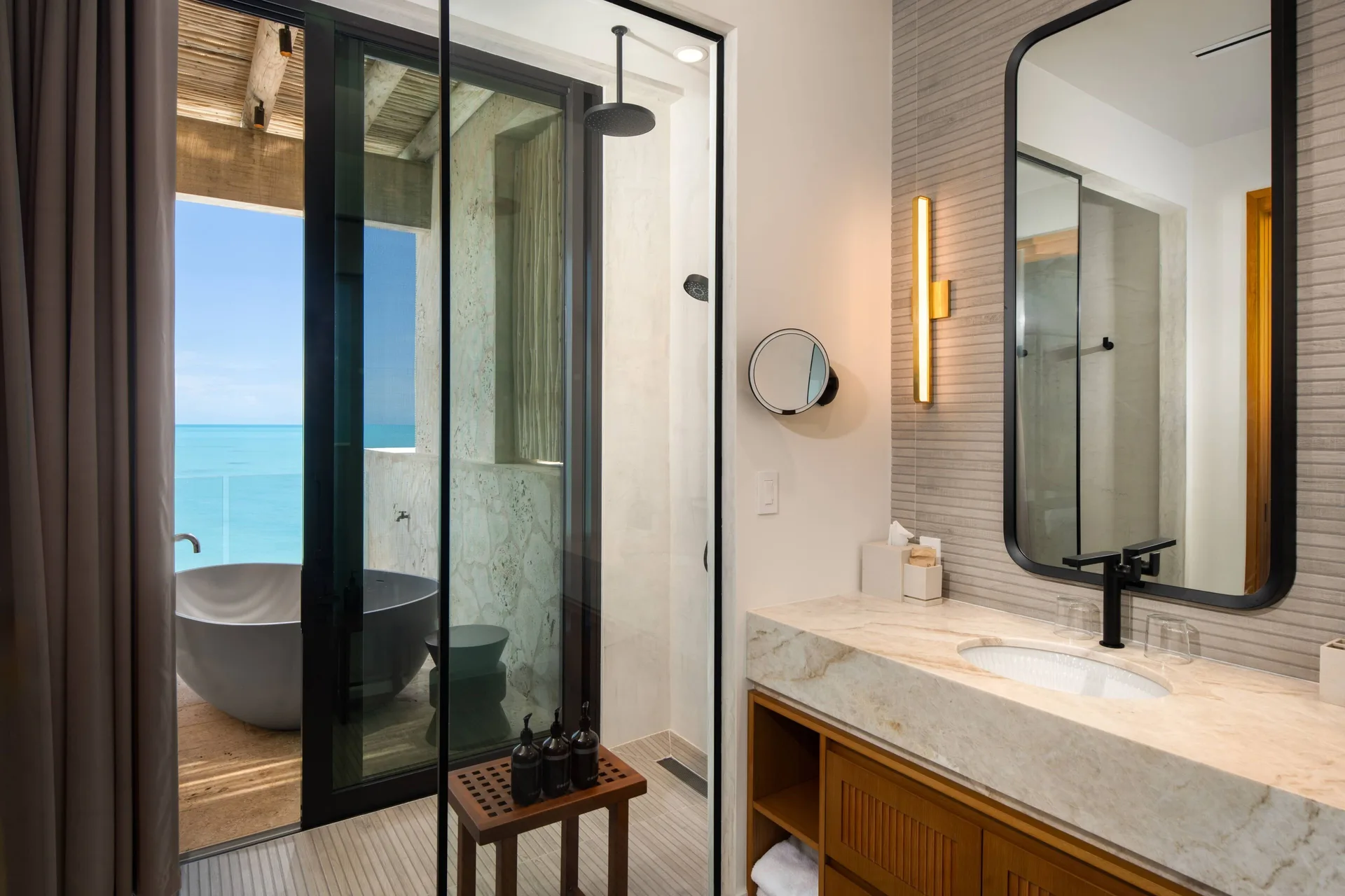 Grand Residence bathroom vanity and ocean-facing tub at The Strand Turks and Caicos.