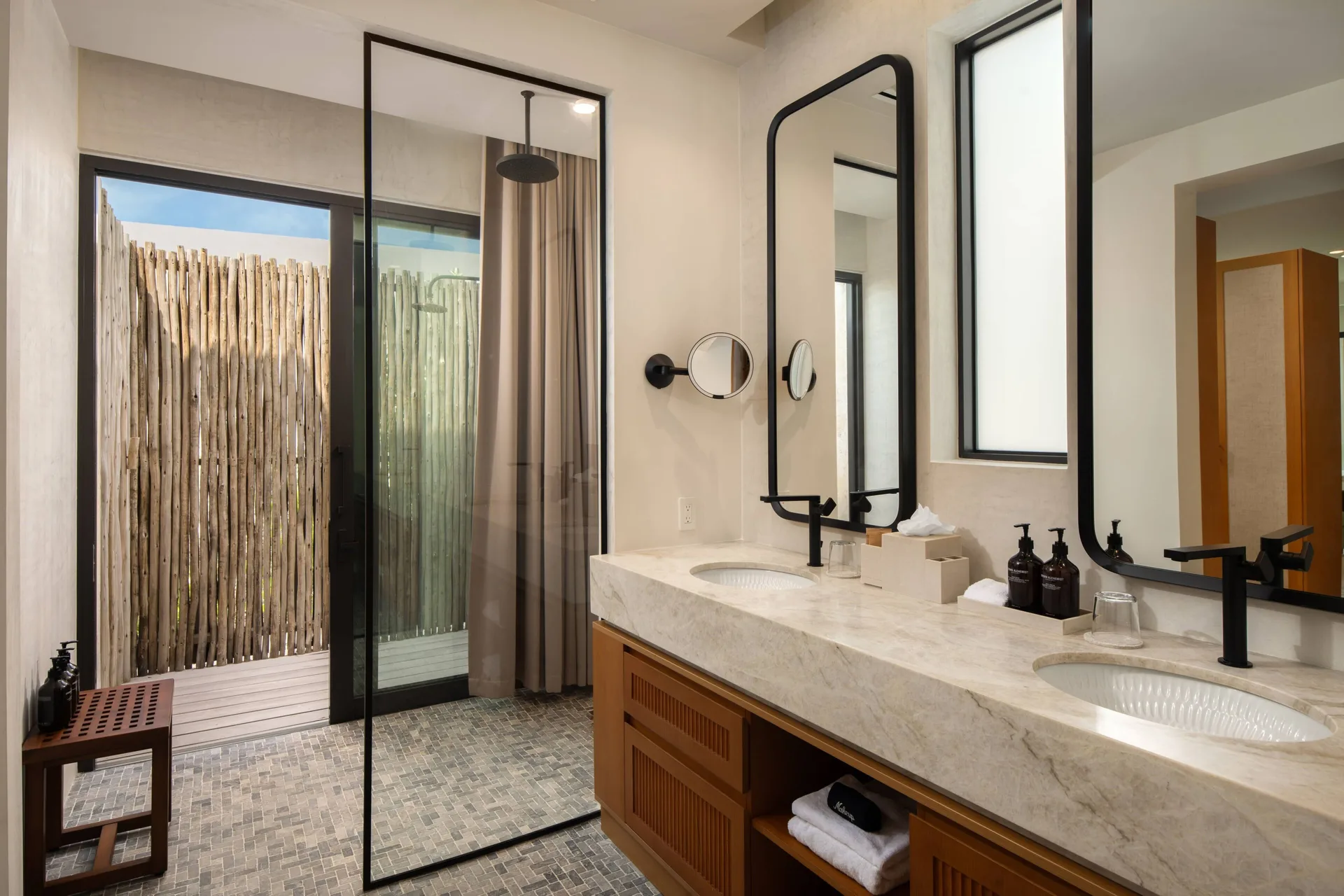 Grand Residence double vanity bathroom and outdoor shower at The Strand Turks and Caicos.