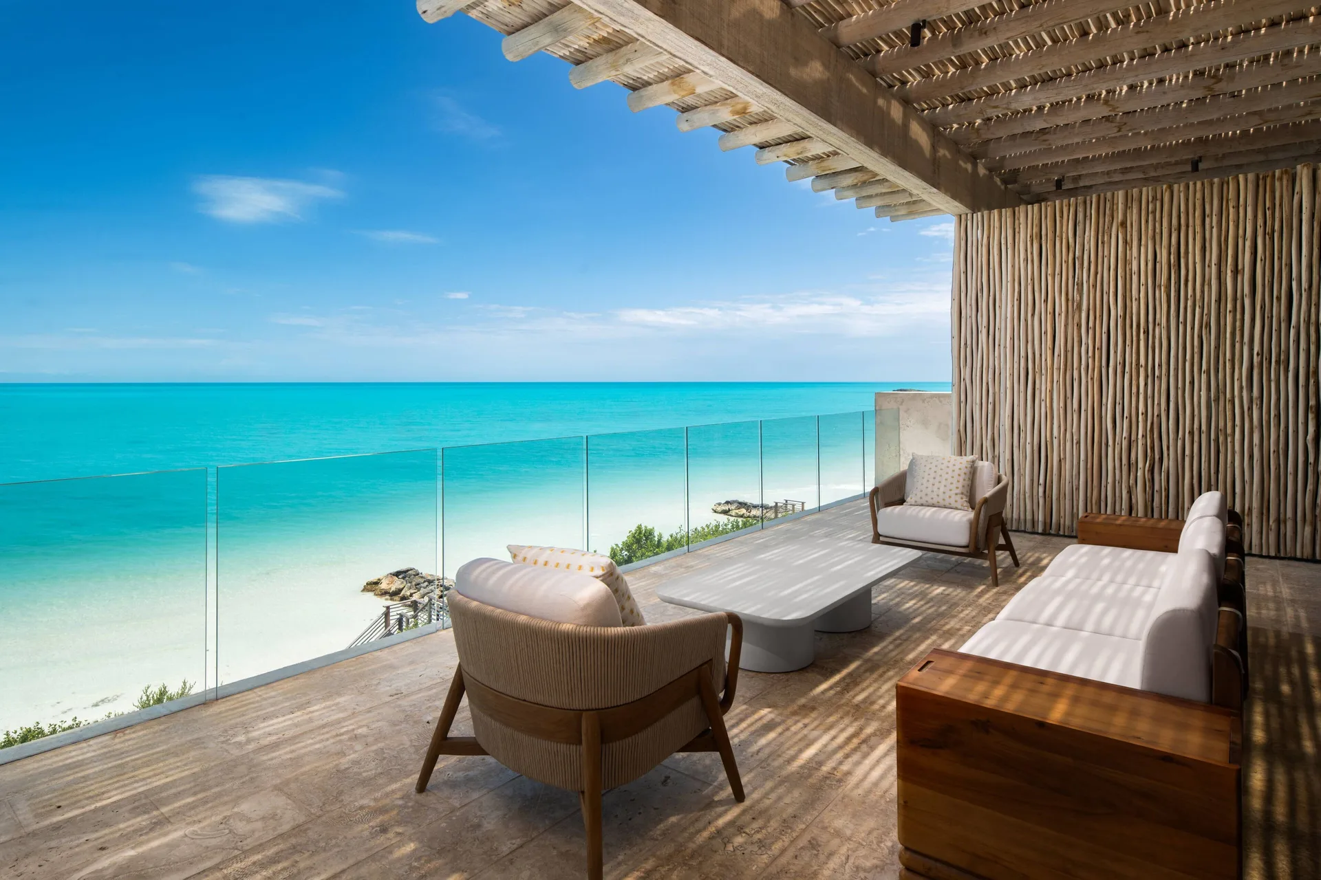 Upper oceanview balcony with lounge seating at The Strand Turks and Caicos.