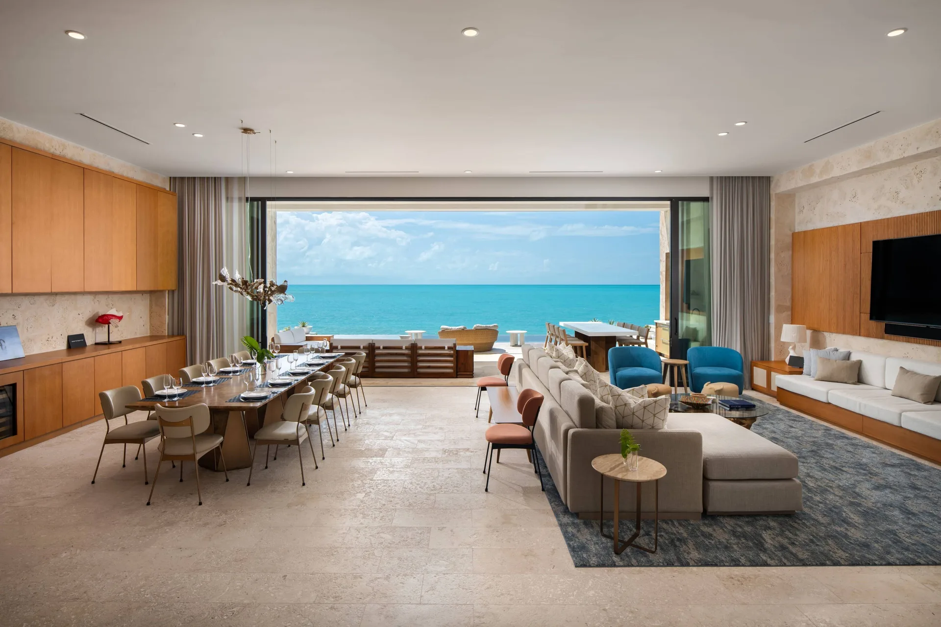 Open living and dining room with wide ocean view at The Strand Turks and Caicos.