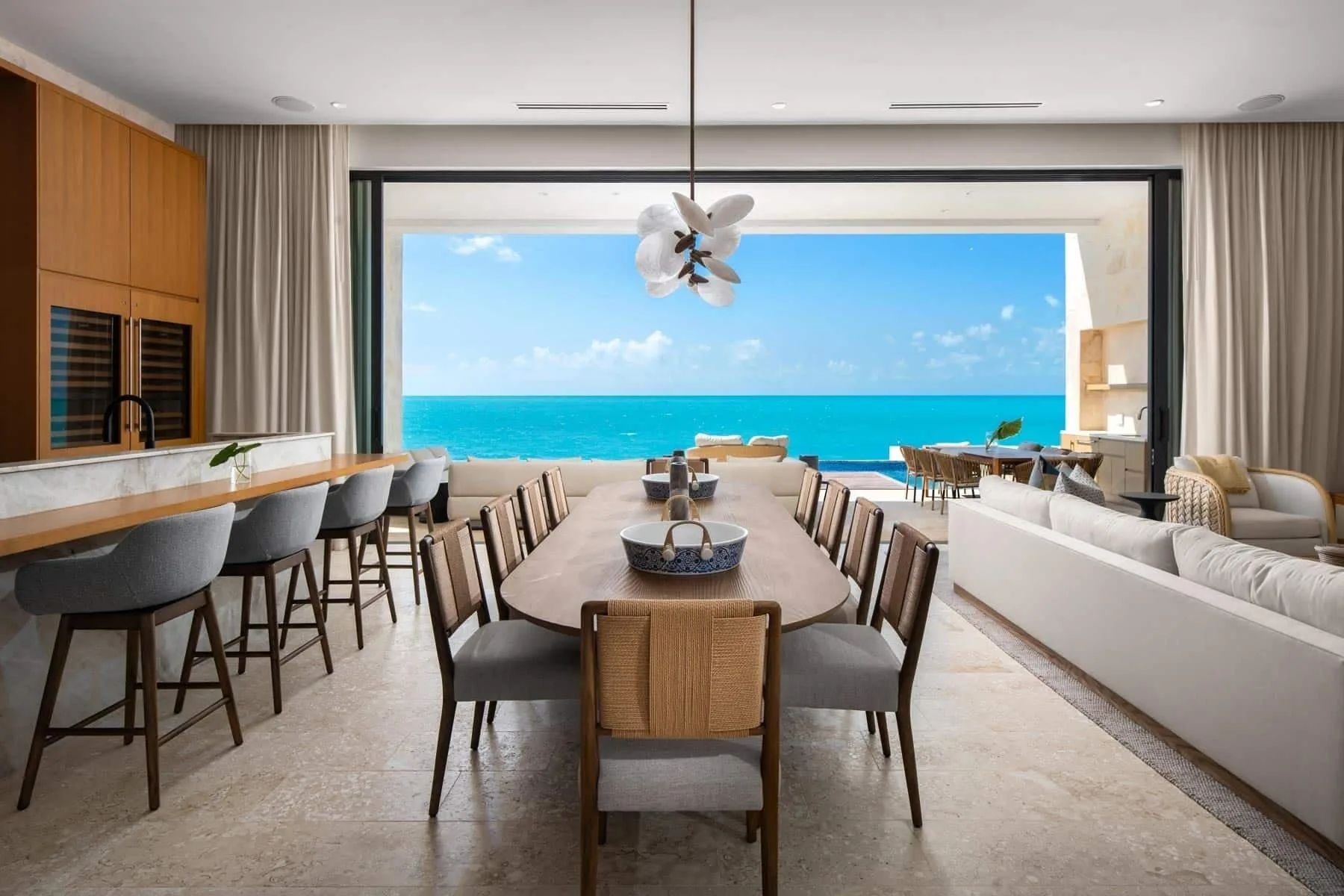 Open dining and kitchen area facing the ocean at The Strand Turks and Caicos.