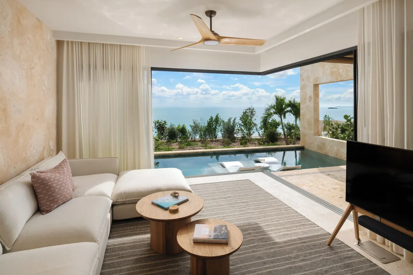 Living area opening to a private pool at The Strand Turks and Caicos.