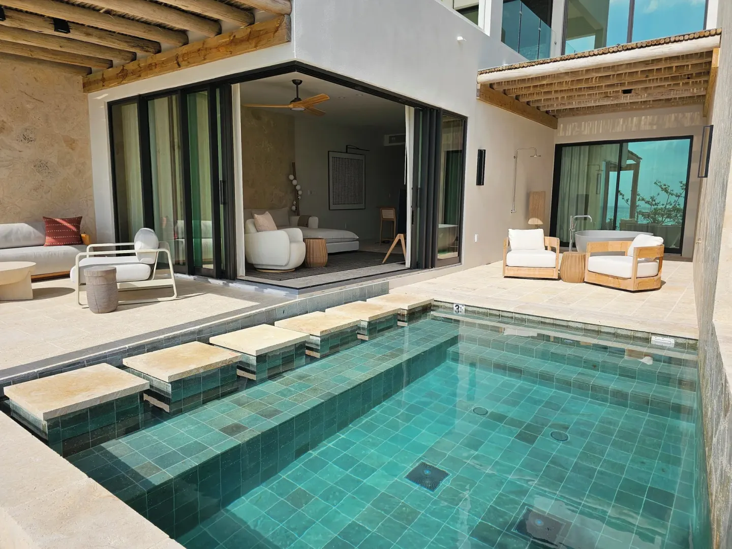 Private plunge pool and patio outside a suite at The Strand Turks and Caicos.