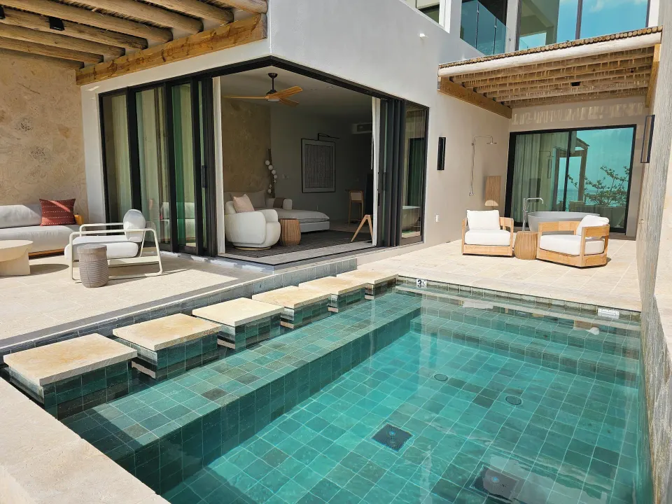 Private plunge pool and patio outside a suite at The Strand Turks and Caicos.