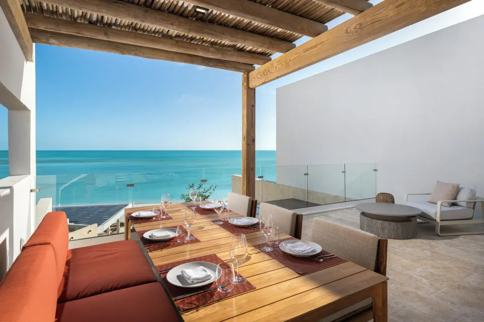 Ocean-view rooftop dining terrace in a suite at The Strand Turks and Caicos.