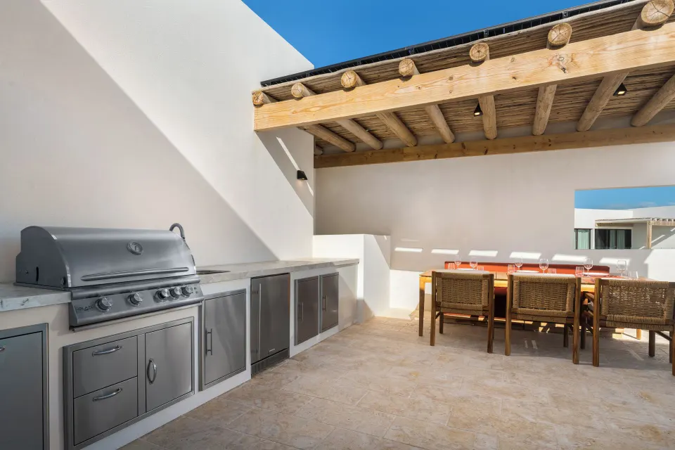 Rooftop terrace kitchen and dining area in a suite at The Strand Turks and Caicos.