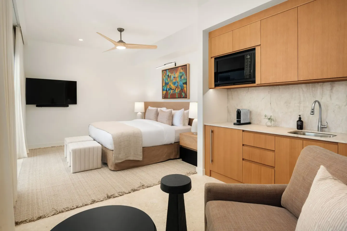 Third-floor suite with king bed and kitchenette at The Strand Turks and Caicos.