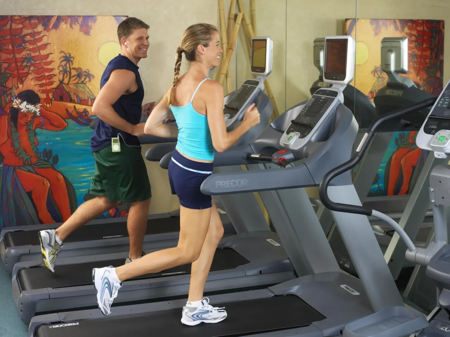 Guests run on treadmills in the fitness room at The Twin Fin Hotel.