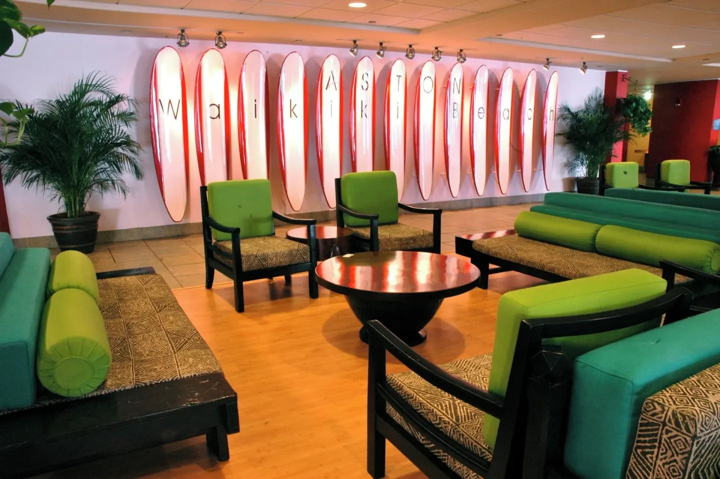 Lobby seating with surfboard wall decor at The Twin Fin Hotel.