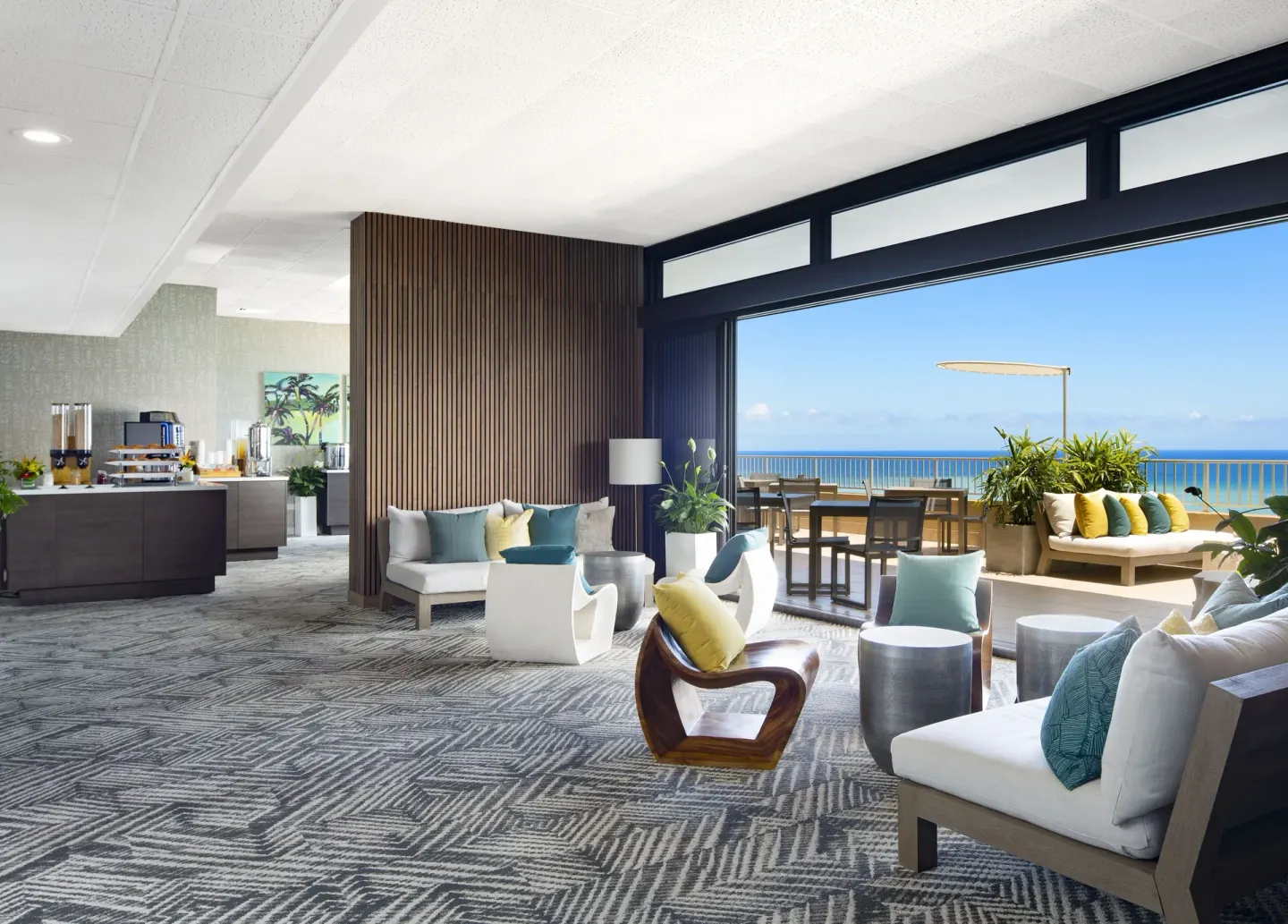 Ocean-view lounge and terrace seating at The Twin Fin Hotel.