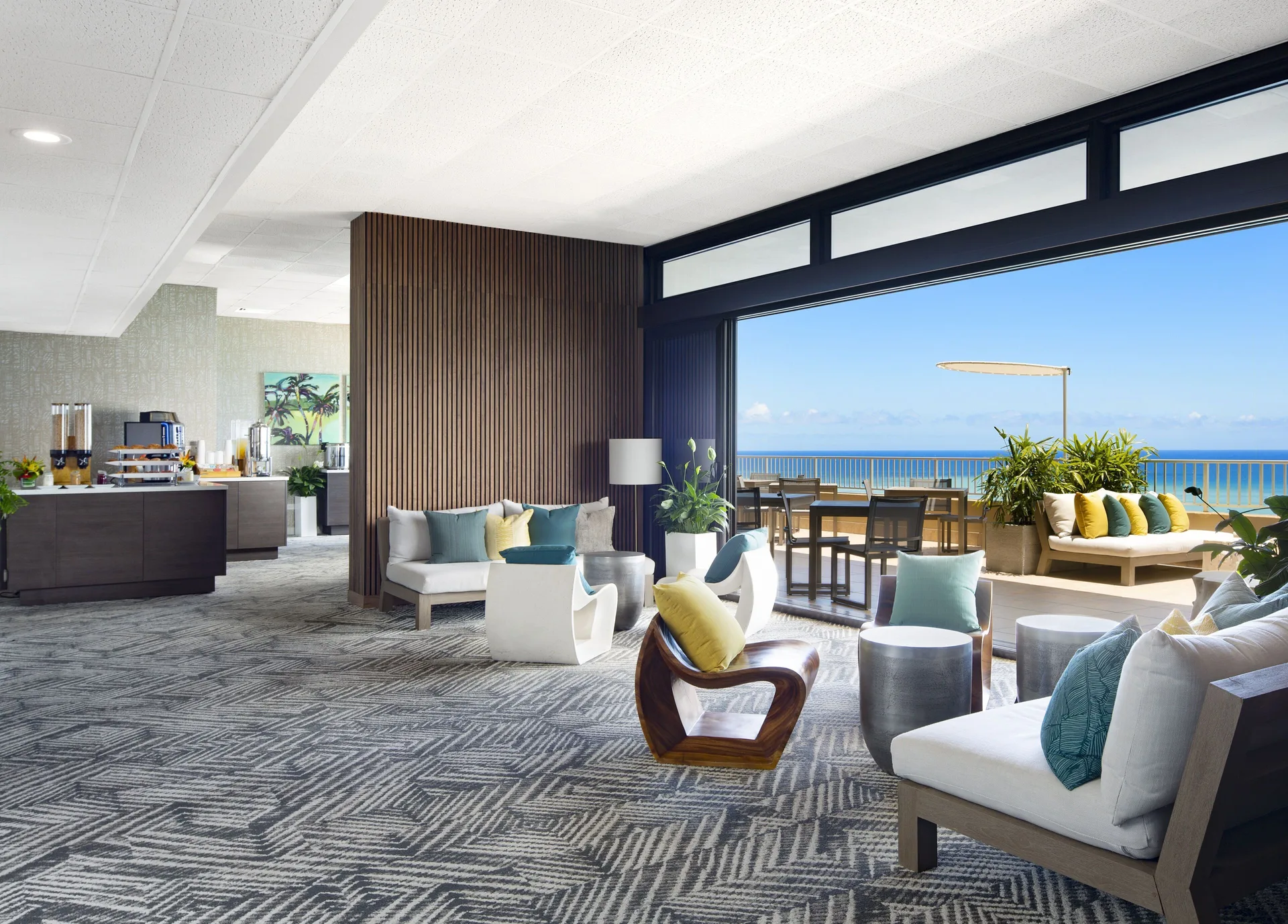 Ocean-view lounge and terrace seating at The Twin Fin Hotel.