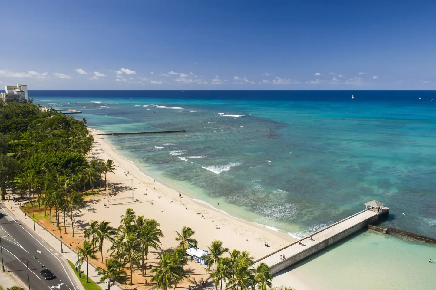 Sunny Waikiki Beach and turquoise ocean view from The Twin Fin Hotel.