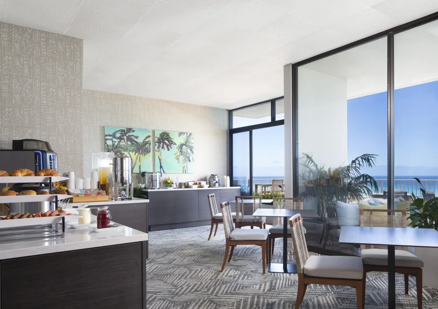 Breakfast buffet seating area with ocean-facing windows at The Twin Fin Hotel.