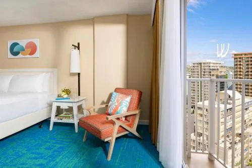 Partial Ocean View room with king bed and balcony at The Twin Fin Hotel.