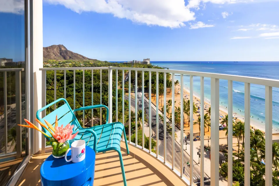 Oceanfront lanai with Diamond Head and beach views at The Twin Fin Hotel.