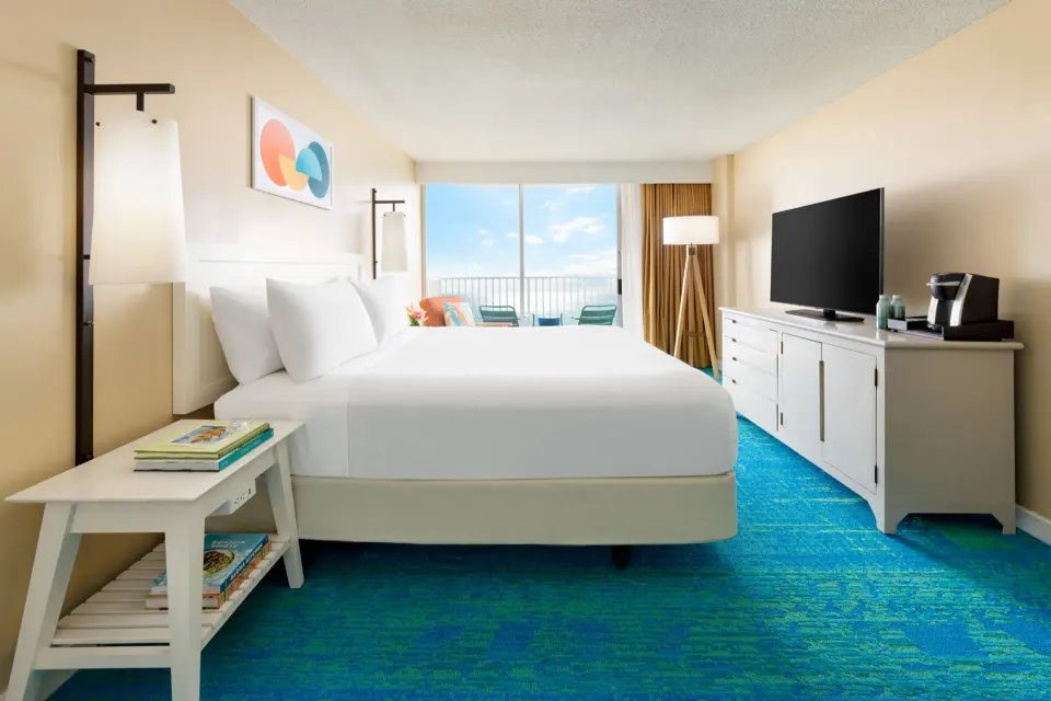 Oceanfront king guest room with lanai at The Twin Fin Hotel.