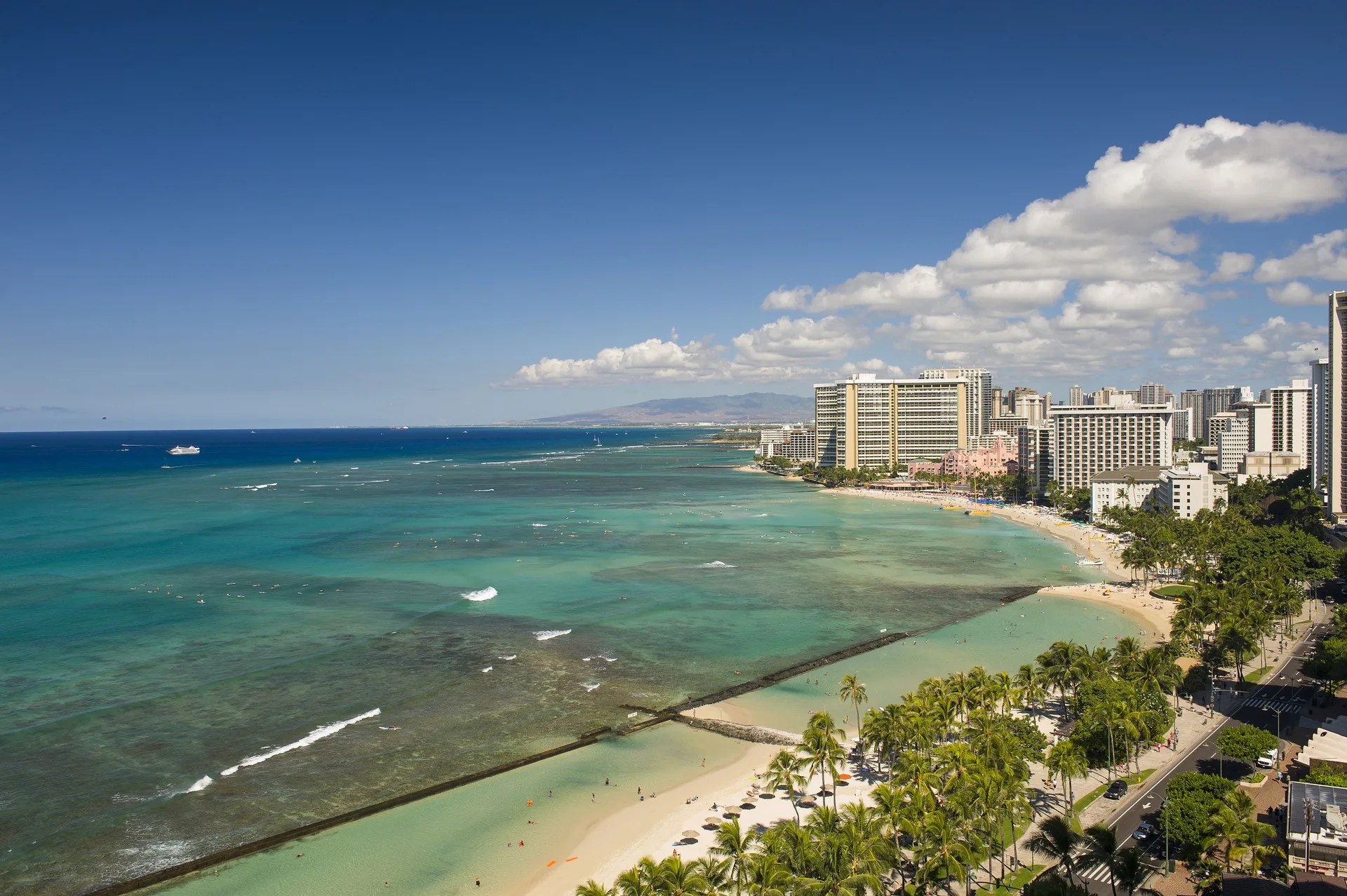 Ocean and Waikiki shoreline view from a three-bedroom suite at The Twin Fin Hotel.