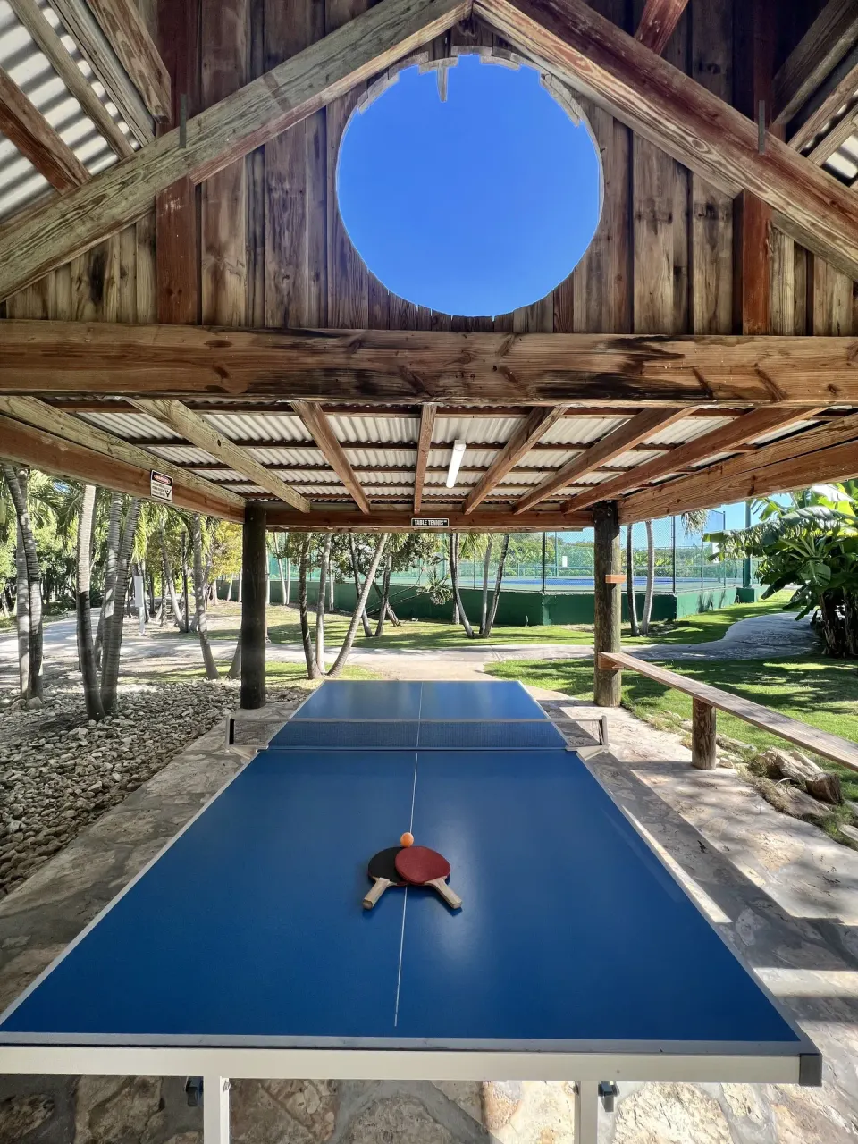 Blue ping-pong table under a wooden shelter at The Verandah Antigua.