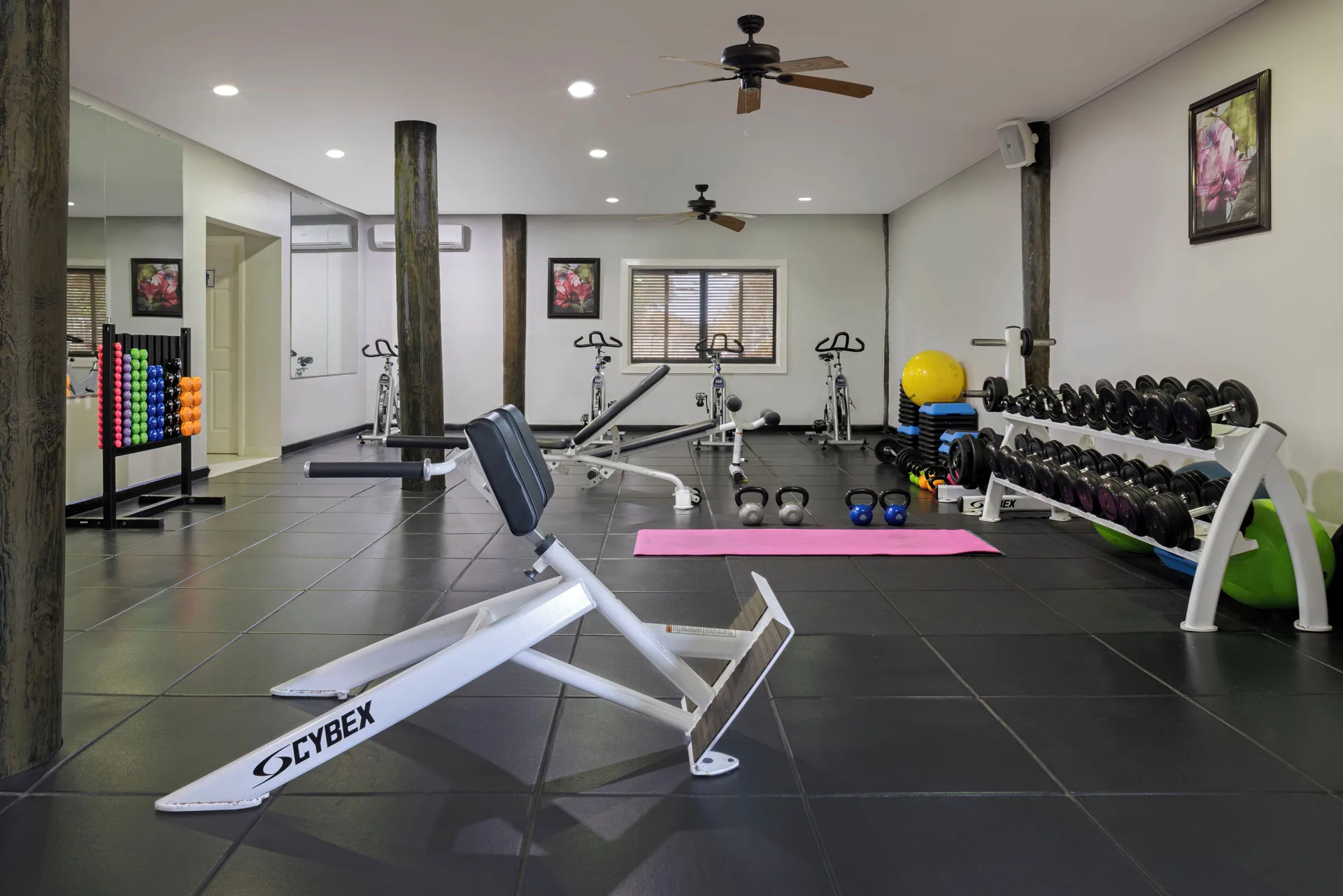 Fitness room with weights, benches, bikes and mats at The Verandah Antigua.
