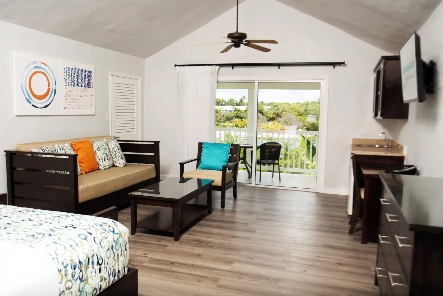 Waterfront suite lounge area with balcony doors at The Verandah Antigua.