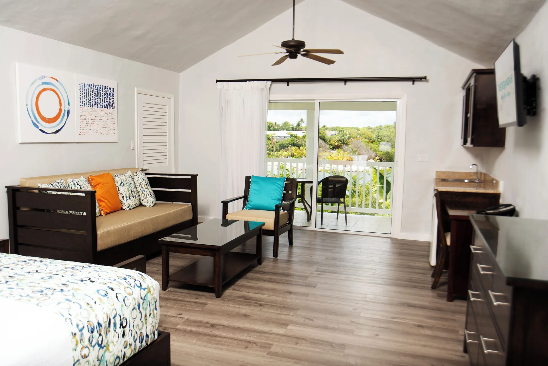 Waterfront suite lounge area with balcony doors at The Verandah Antigua.