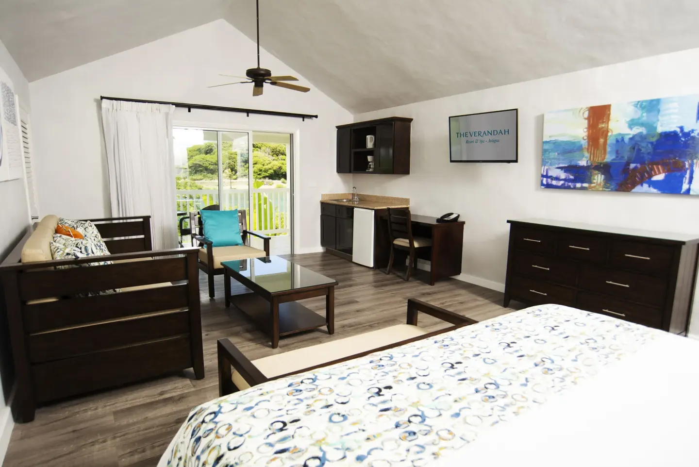 Waterfront suite bedroom and sitting area at The Verandah Antigua.