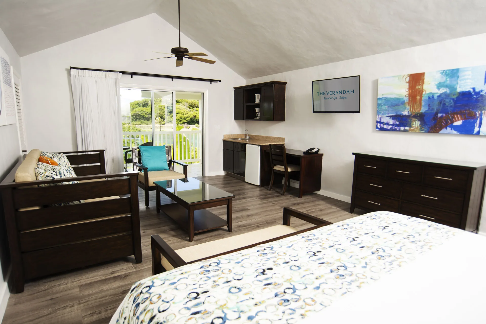 Waterfront suite bedroom and sitting area at The Verandah Antigua.
