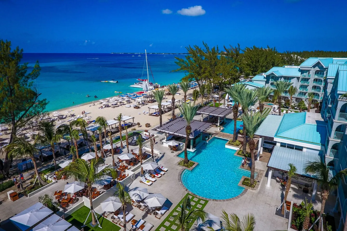 Aerial view of beach, pool and buildings at The Westin Grand Cayman Seven Mile Beach Resort & Spa.