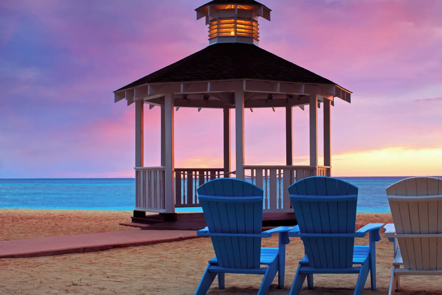 Beach gazebo and Adirondack chairs at The Westin Grand Cayman Seven Mile Beach Resort & Spa.