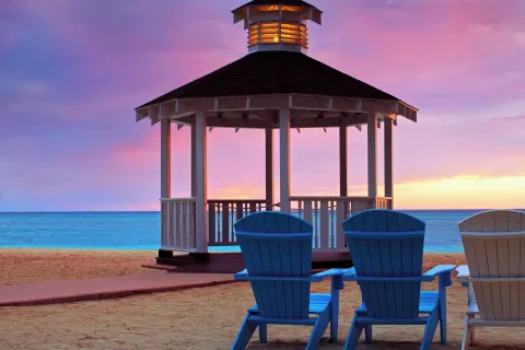 Beach gazebo and Adirondack chairs at The Westin Grand Cayman Seven Mile Beach Resort & Spa.