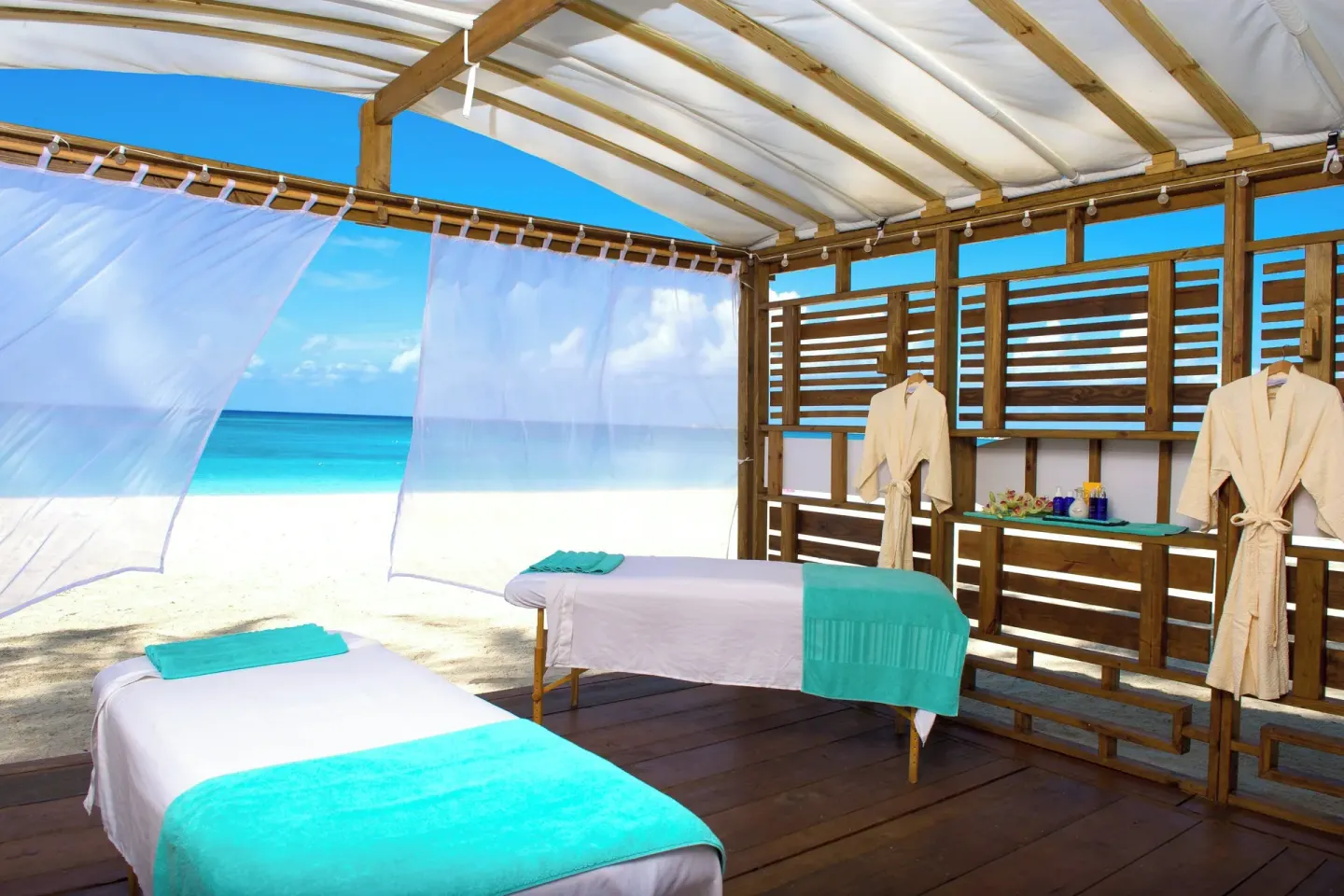 Beach massage cabana with two treatment tables at The Westin Grand Cayman Seven Mile Beach Resort & Spa.